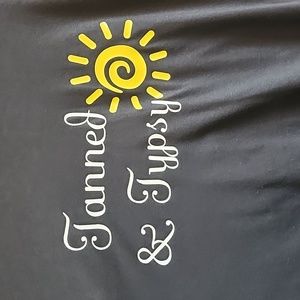 Black Ligh weight short sleeve T Tanned and Typsy, white writing, yellow sun